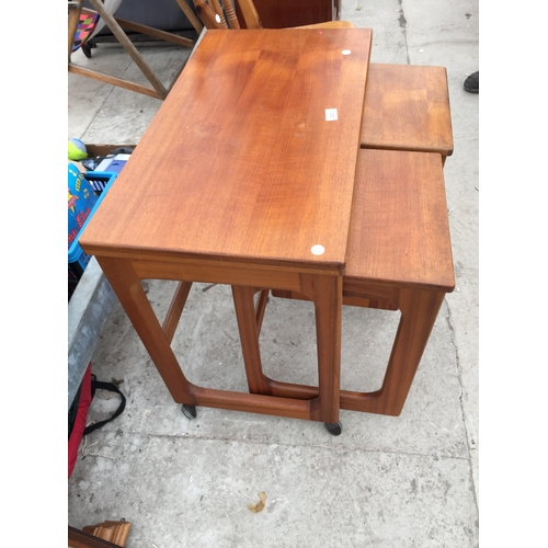 2863 - A RETRO TEAK 'MCINTOSH TRIFORM' NEST OF THREE TABLES WITH FOLD-OVER TOP