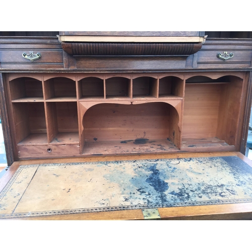 2880 - A LATE VICTORIAN OAK BUREAU BOOKCASE WITH ASTRAGAL GLAZED DOOR, FALL FRONT, CUPBOARDS, DRAWERS AND O... 