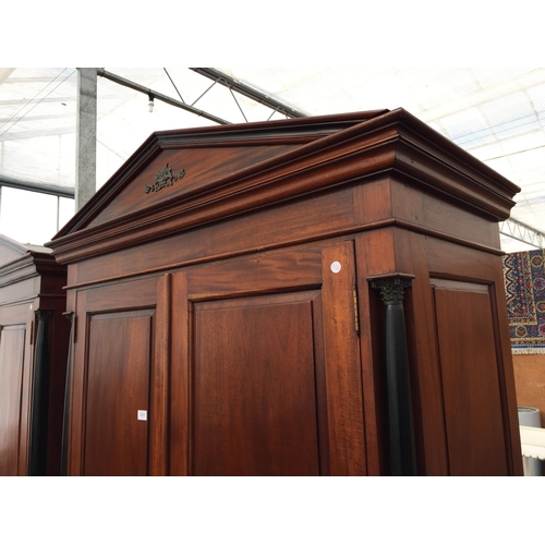 2883 - A MODERN HARDWOOD TWO DOOR WARDROBE WITH EBONISED CORINTHIAN COLUMNS, ON BRACKET FEET, 49.5