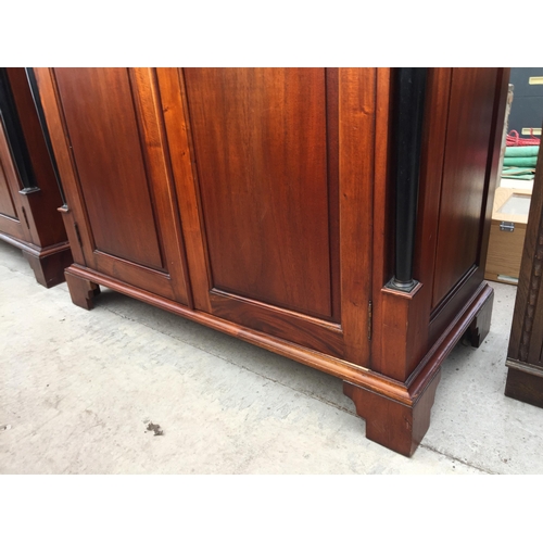 2883 - A MODERN HARDWOOD TWO DOOR WARDROBE WITH EBONISED CORINTHIAN COLUMNS, ON BRACKET FEET, 49.5