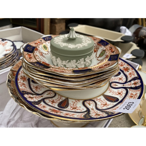 2063 - AN ASSORTMENT OF CERAMICS TO INCLUDE PLATES AND CAPS AND SAUCERS ETC