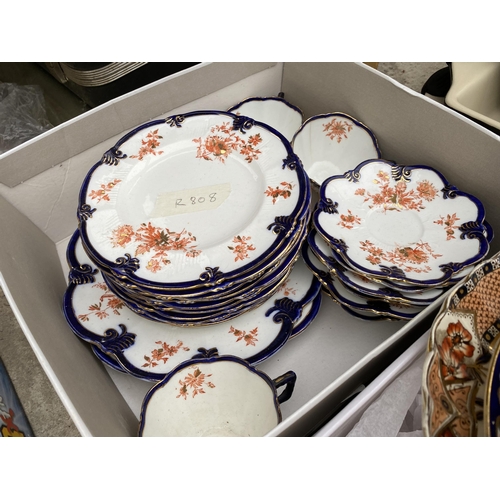 2063 - AN ASSORTMENT OF CERAMICS TO INCLUDE PLATES AND CAPS AND SAUCERS ETC