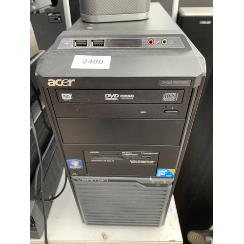 2400 - AN ACER COMPUTER TOWER, A COMPUTER MONITOR AND A SPEAKER