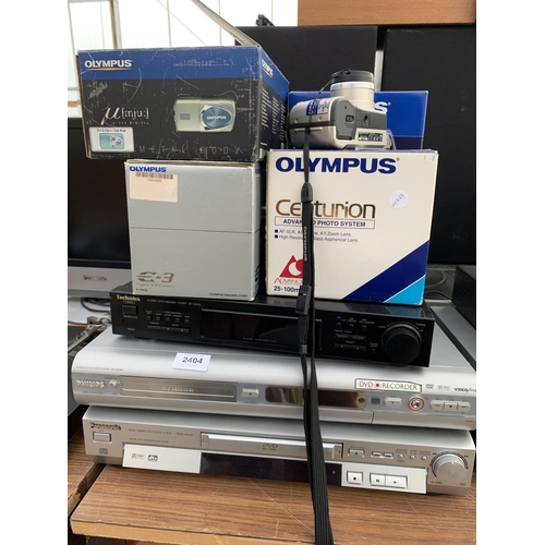 2404 - FOUR BOXED OLYMPUS CAMERAS TO INCLUDE A CENTURIAN, MJU, IS5000 AND IXE-3 PLUS VHS AND DVD PLAYERS