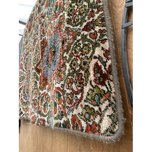 2493 - A COLOURFUL PATERNED RUG