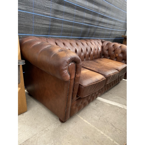 2903 - A BROWN CHESTERFIELD THREE SEATER SETTEE AND MATCHING EASY CHAIR