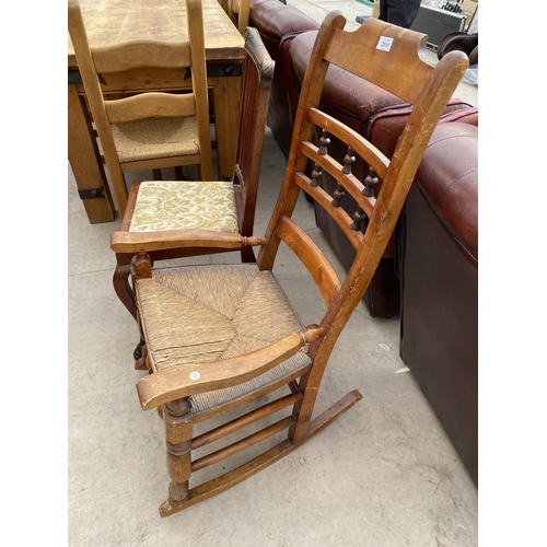 2910 - A VICTORIAN BEECH ROCKING CHAIR WITH RUSH SEAT AND EARLY 20TH CENTURY DINING CHAIR ON CLAW FEET