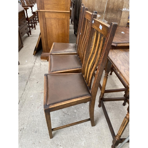 2937 - THREE MID 20TH CENTURY OAK DINING CHAIRS