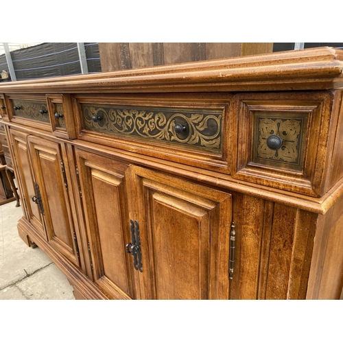 2938 - AN ANTIQUE STYLE HARDWOOD SIDEBOARD WITH TWO LONG & TWO SMALL FRIEZE DRAWERS ALL WITH FOLIATE DECORA... 