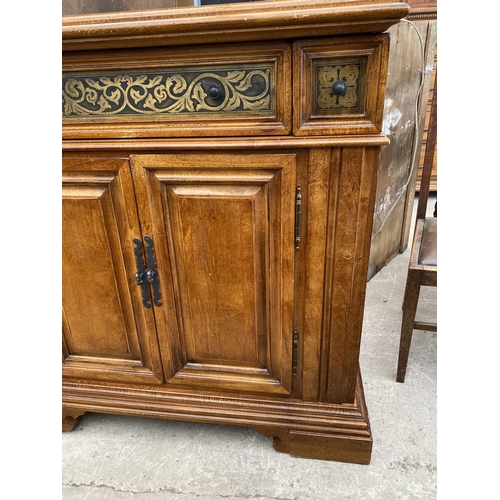 2938 - AN ANTIQUE STYLE HARDWOOD SIDEBOARD WITH TWO LONG & TWO SMALL FRIEZE DRAWERS ALL WITH FOLIATE DECORA... 