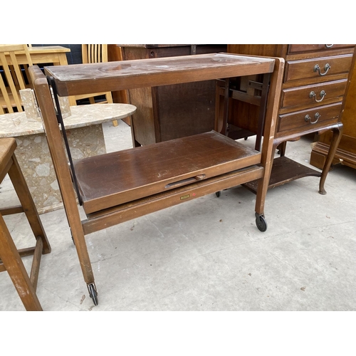 2940 - A RETRO TEAK TRI-MAGIC FOLD OVER TROLLEY TABLE