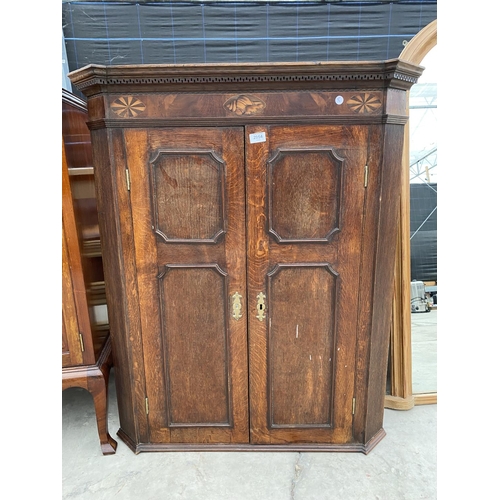 2954 - A GEORGE III OAK AND INLAID CORNER CUPBOARD WITH SHAPED INTERIOR SHELVES 35 INCH WIDE