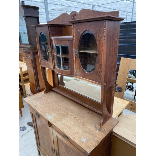 2956 - AN OAK ART NOUVEAU MIRROR BACK SIDEBOARD WITH OVAL GLASS DOORS TO UPPER PORTAL 43 INCH WIDE