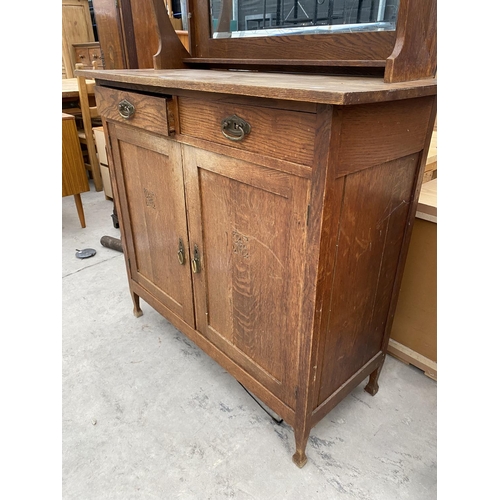 2956 - AN OAK ART NOUVEAU MIRROR BACK SIDEBOARD WITH OVAL GLASS DOORS TO UPPER PORTAL 43 INCH WIDE