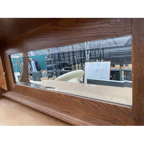 2956 - AN OAK ART NOUVEAU MIRROR BACK SIDEBOARD WITH OVAL GLASS DOORS TO UPPER PORTAL 43 INCH WIDE