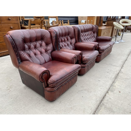 2960 - AN OXBLOOD 2 SEATER BUTTON BACK SETTEE AND 2 EASY CHAIRS