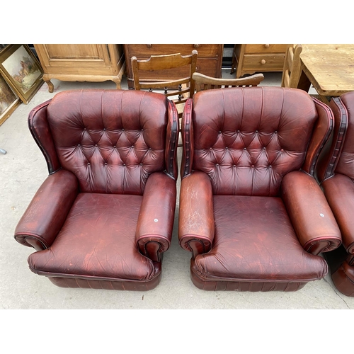 2960 - AN OXBLOOD 2 SEATER BUTTON BACK SETTEE AND 2 EASY CHAIRS