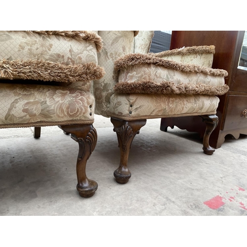 2965 - A PAIR OF GEORGE III STYLE WING BACK LOUNGE CHAIRS ON CABRIOLE LEGS