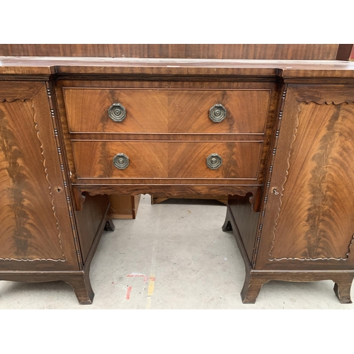 2763 - AN EDWARDIAN MAHOGANY PEDESTAL BREAKFRONT SIDEBOARD ENCLOSING TWO CUPBOARDS, ONE BEING A CELLARETTE ... 