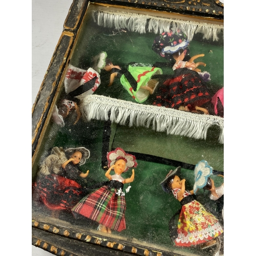 311 - A VINTAGE WOODEN CASED SET OF DANCING LADY FIGURES