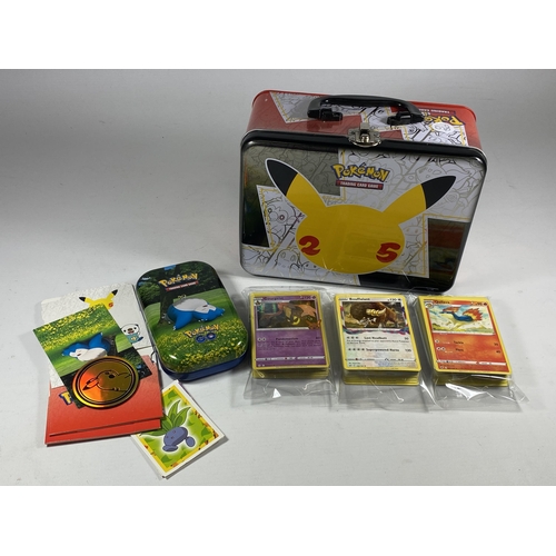 346 - A POKEMON 25TH ANNIVERSARY TIN WITH ASSORTED CARDS, GAME TOKENS ETC