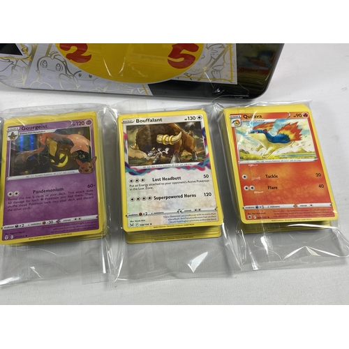 346 - A POKEMON 25TH ANNIVERSARY TIN WITH ASSORTED CARDS, GAME TOKENS ETC