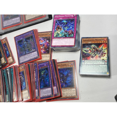 352 - A LARGE COLLECTION OF YU-GI-OH CARDS TO INCLUDE A FOLDER OF ASSORTED CARDS ETC