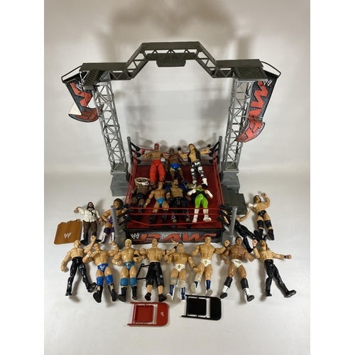 364 - A LARGE COLLECTION OF W.W.E WRESTLING FIGURES IN RING WITH BELTS ETC