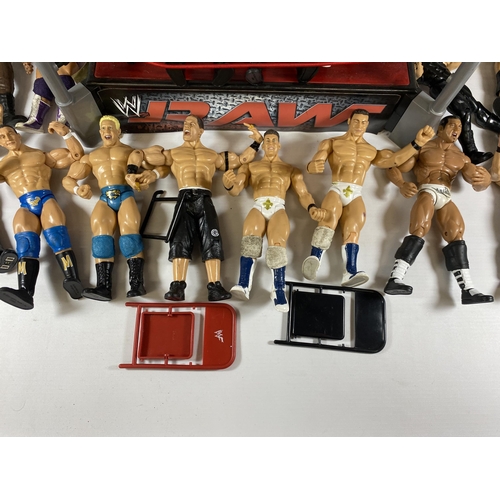 364 - A LARGE COLLECTION OF W.W.E WRESTLING FIGURES IN RING WITH BELTS ETC