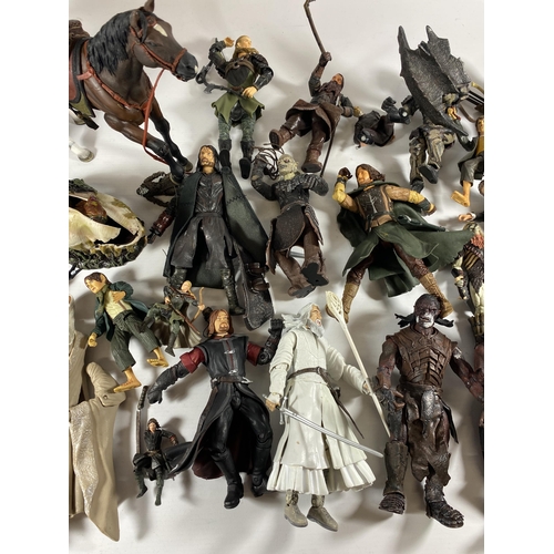 365A - A LARGE COLLECTION OF LORD OF THE RINGS FIGURES AND WEAPONS AND ACCESSORIES ETC