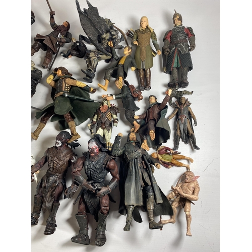 365A - A LARGE COLLECTION OF LORD OF THE RINGS FIGURES AND WEAPONS AND ACCESSORIES ETC