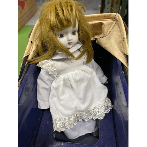 391 - A VINTAGE METAL PRAM WITH PORCELAIN HEADED DOLL