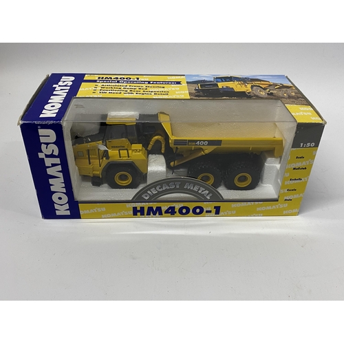 402 - A BOXED KOMATSU HM 400-1 ARTIC DUMP TRUCK REF NO 40014 SCALE 1:50