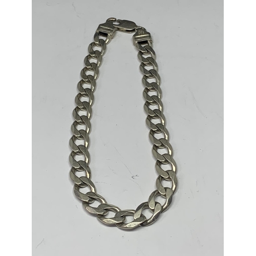 554 - A HEAVY SILVER FLAT LINK BRACELET