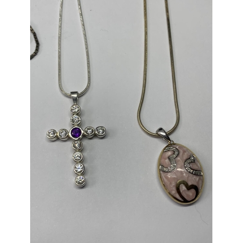 560 - FOUR SILVER NECKLACES WITH PENDANTS