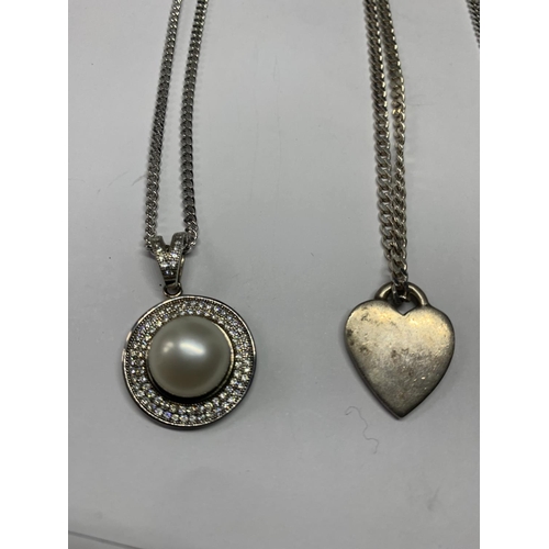 562 - FOUR SILVER NECKLACES WITH PENDANTS