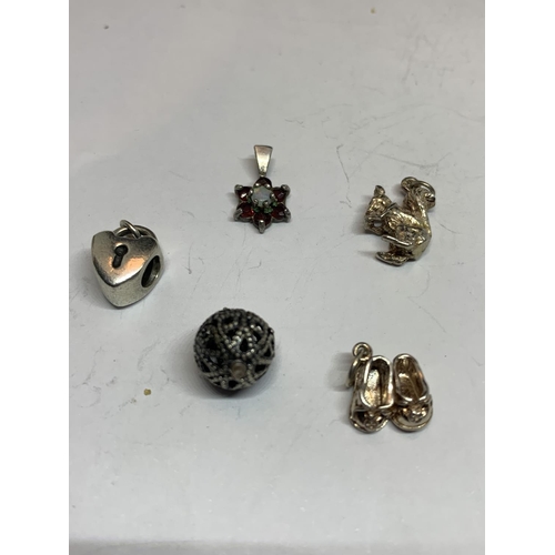 583 - TEN VARIOUS SILVER CHARMS