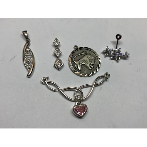 584 - TEN VARIOUS SILVER PENDANTS