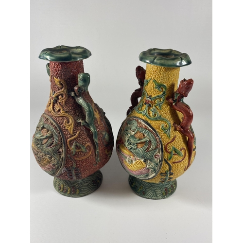 490 - A PAIR OF UNUSUAL CHINESE LACQUERED RELIEF MOULDED DESIGN VASES, HEIGHT 19CM