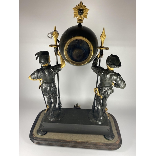 12 - A FRENCH JAPY FERERES SPELTER TWO TRAIN DOMED CLOCK WITH TWIN FIGURAL DESIGN, DOME HEIGHT 64CM, WITH... 