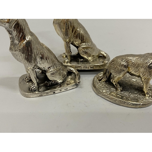 27 - A GROUP OF THREE HALLMARKED SILVER FILLED CAMELOT SILVERWARE LTD DOG FIGURES
