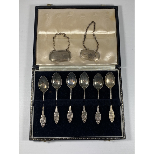 4 - A CASED SET OF SIX HALLMARKED SILVER TEASPOONS WITH SWAN DESIGN HANDLE AND TWO SILVER DECANTER LABEL... 