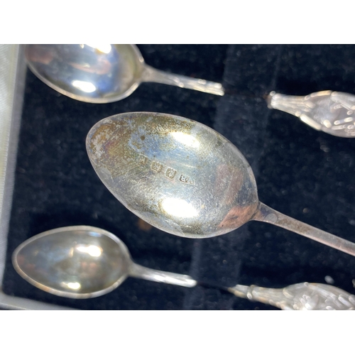 4 - A CASED SET OF SIX HALLMARKED SILVER TEASPOONS WITH SWAN DESIGN HANDLE AND TWO SILVER DECANTER LABEL... 