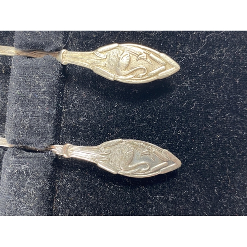 4 - A CASED SET OF SIX HALLMARKED SILVER TEASPOONS WITH SWAN DESIGN HANDLE AND TWO SILVER DECANTER LABEL... 