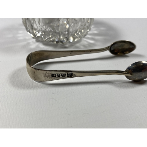 505 - TWO HALLMARKED SILVER ITEMS - SMALL SUGAR TONGS AND CUT GLASS OPEN SALT