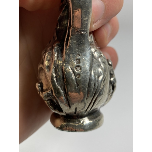 603 - A SILVER GRECIAN DESIGN SMALL JUG