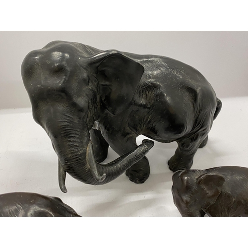 84 - A SET OF THREE VINTAGE SPELTER/LEAD ELEPHANT MODELS, HEIGHT 19CM