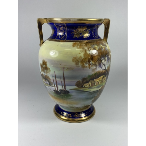 853 - A NORITAKE TWIN HANDLED VASE WITH LAKE SCENE, HEIGHT 22CM, ONE HANDLE A/F