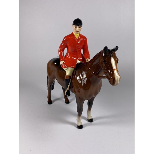 857 - A BESWICK HUNTSMAN ON HORSEBACK FIGURE IN RED JACKET