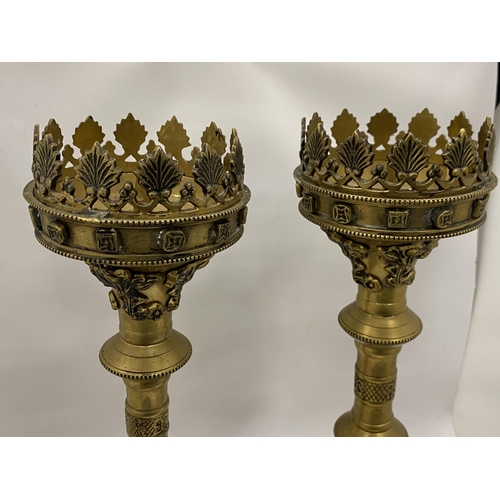 87 - A PAIR OF VINTAGE BRASS GOTHIC STYLE CANDLE HOLDERS, HEIGHT 49CM